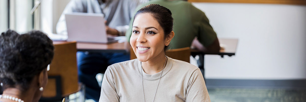 auto loan rates near buffalo ny image of smiling woman and loan officer